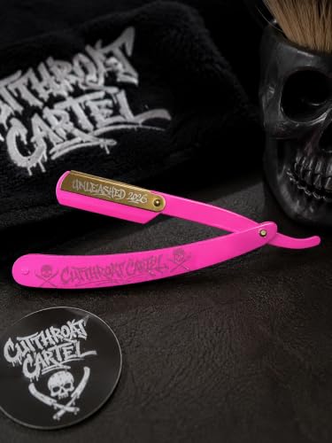 The pink razor resting on a black Cutthroat Cartel towel next to a round logo sticker.
